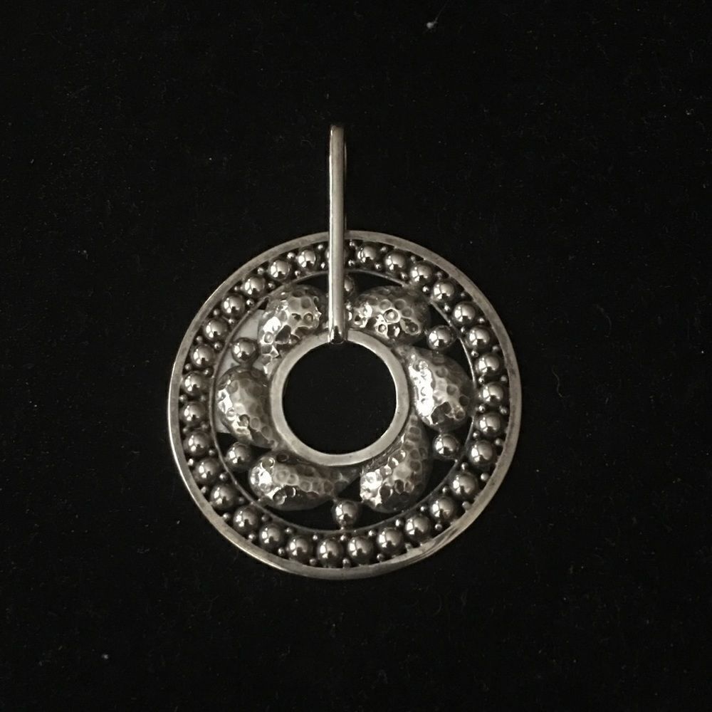 sterling silver hammered circular pendant